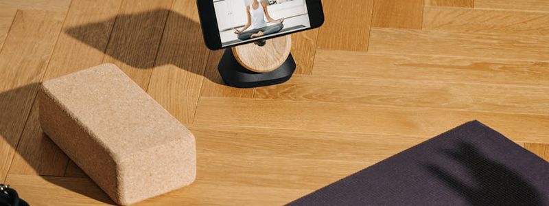 Yoga wooden blocks and mat on floor